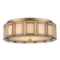 Bottom up view of flush mount showing brass central knob and perimeter framing