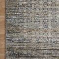 Corner of Soho Charcoal rug on wood floor showing fringe and abstract multi-tone pattern
