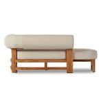Close view of woven beige olefin fabric texture on chaise cushioning