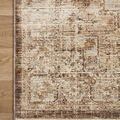 Corner close-up of Sorrento Mocha rug with beige fringe on light wood floor