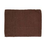 Rectangular woven placemat in rust color with subtle texture and frayed edges