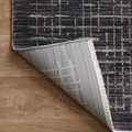 Back corner of Soho Onyx Silver Rug turned up, revealing woven backing