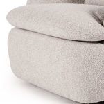 Close-up showing thick overstuffed T-shaped seat cushion resting on chair base