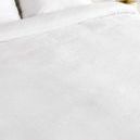 Close-up of soft white linen cashmere blend fabric texture on duvet