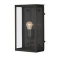 Close-up highlighting curved sconce arm and bulb holder inside matte black frame