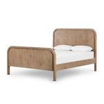 Queen bed made from mixed reclaimed wood with curved headboard and footboard in natural finish