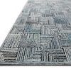 Low-angle side view highlighting the rug's high-low pile texture and varying blue tones