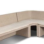 View from side corner showing smooth rattan weaving and textured cushions