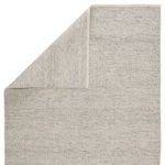 Rug flipped to show subtle variation in tone and texture on the reverse side