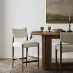 Jayla Counter Stool in styled dining room with rug, table, and artwork