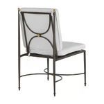 Back view of chair highlighting gold decorative knob and wrought aluminum frame