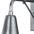 Close-up of sconce curved arm and socket detail with subtle surface sheen