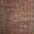 Traditional vintage-style rectangular rug with intricate faded patterns in brick red and blue accents