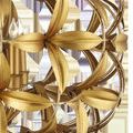 Close-up showing detailed gold leaf flower petals and inner candle-shaped light bulbs