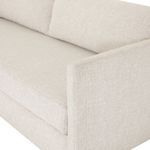 Close-up on upholstery texture and clean stitching on arm and cushions
