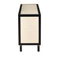 Straight side view focusing on ivory raffia side panel framed with black wood and black legs