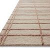 Side angle close-up showing the rug’s alternating high-low pile and textured linear pattern details