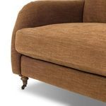 Detail close-up of thick back cushion with soft brown fabric on Lynne Sofa.