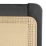 Close-up of black eucalyptus wood frame corner and woven cane detailing on backrest panel