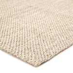 Close-up corner angled view highlighting woven sisal texture and taupe-white color blend