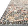 Close-up side angle showing low pile and detailed edge stitching of Saban Blue Spice rug