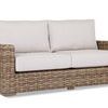 Havana Loveseat in weathered tobacco resin wicker with plush off-white cushions and a sturdy square frame