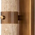 Close-up detail of antique brass bracket holding travertine center column in place
