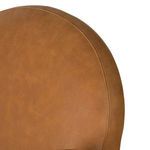 Detailed shot of stitched curved rounded back panel of the chair