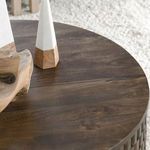 Close-up of decorative items on the Norwood coffee table's top surface in a living room setting