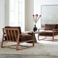 Two Moraine Accent Chairs styled in bright room with large modern wall art and round black coffee table