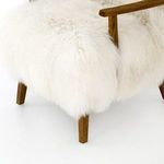 Close-up of wooden armrest and densely packed Mongolian fur seat