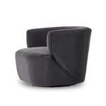 Chair shown at an angle illustrating the curve from back to armrest and seat