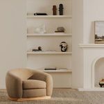 Marlowe lounge chair styled in a cozy living room with light carpet and minimal décor