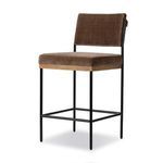 Three-quarter view showing square iron frame and cushioned brown fabric on seat and back