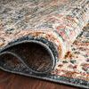 Rolled edge close-up highlighting the dense, stain-resistant polyester pile and binding of the rug