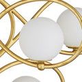 Close-up showing gold wrought iron detailing and three frosted glass spheres
