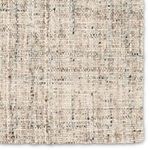 Close-up detail of rug’s chunky woven texture highlighting subtle tweed pattern