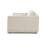 Right side view of sectional outlined by smooth upholstery in cream basketweave fabric