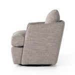 Left side view emphasizing tapered backrest and armrest design with swivel base