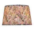 Back view displaying continuous floral pattern wrapping around pleated tapered lamp shade