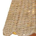 Detailed close-up of natural seagrass fibers and handcrafted wicker pattern on chandelier shade