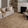 Wade Clay Silver Rug styled in living room with neutral sofa, fireplace, and minimalist decor