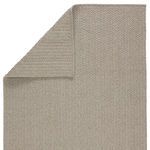 Rug flipped to show reverse side with same light gray color and tight textured weave