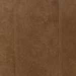 Detailed overhead view of sofa corner showing leather surface and clean stitch lines.
