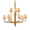 Goldfinch chandelier with white lamp shades on bulbs, evenly spaced around the frame