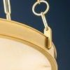 Close-up of bracket and round chain link with alabaster diffuser lit behind