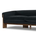Repeat of close detailed view of armrest corner highlighting velvet upholstery curvature