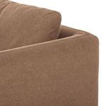 Top corner detail of backrest showing piping and linen fabric texture