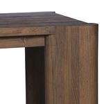 Close-up on corner joint and tabletop edge with visible wood texture and finish