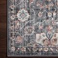 Tight shot of decorative corner on dark hardwood floor showing detailed floral corner design